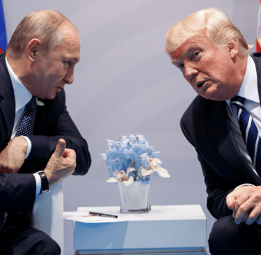 a man in a suit and tie is talking to a woman