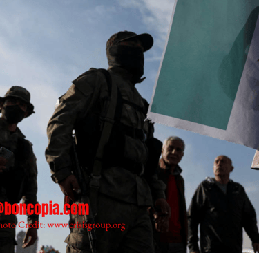 a group of soldiers with their backs turned to look like they are holding a flag