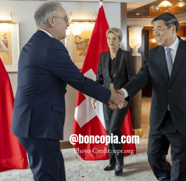 a man in a suit and tie is shaking hands with a woman in a suit