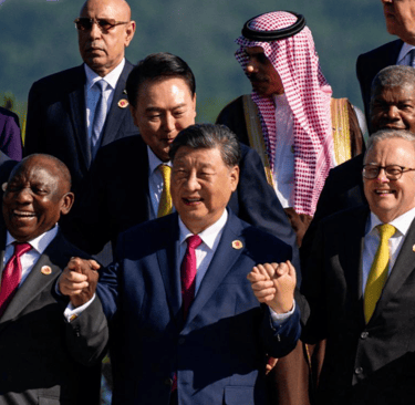 a group of men and women standing in front of a crowd
