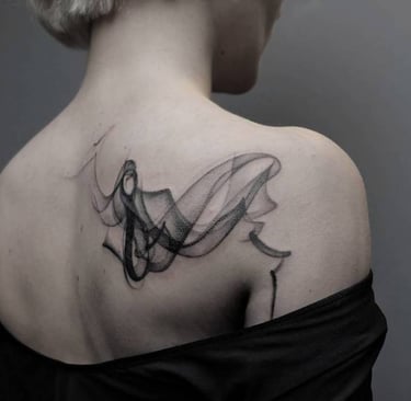 a woman with a tattoo on her back
