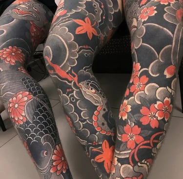 a woman with tattoos on her leggings and leggings