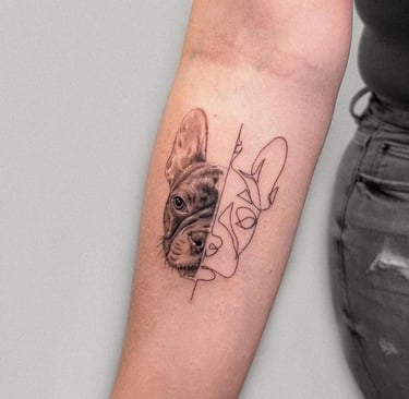 a dog is shown with a dog tattoo on the arm