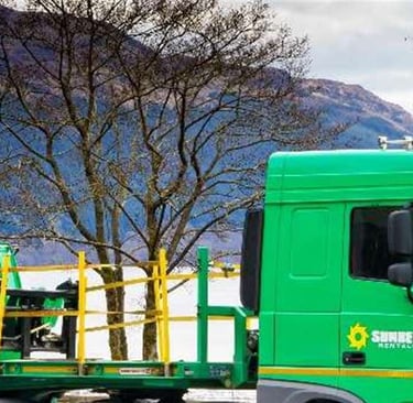Sunbelt rentals lorry in front of Scottish loch to illustrate a testimonial