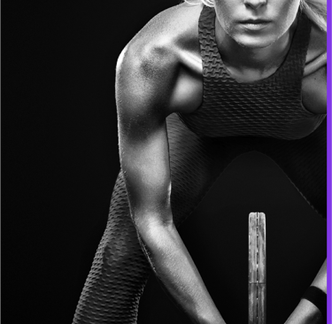 a woman in a sports bra and a tennis racket