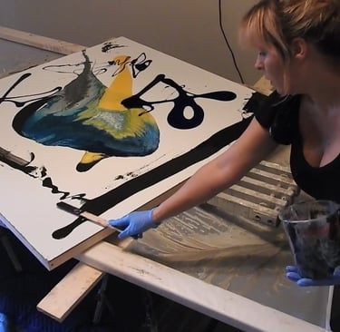 I am in gloves and painting an abstract painting