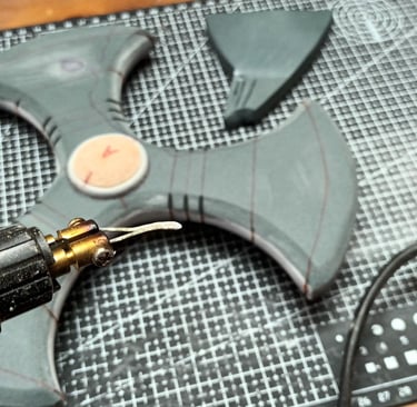 engraving details into a cosplay weapon with a pyrography station