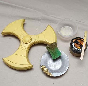adding a smooth coat of gold paint on primed EVA foam
