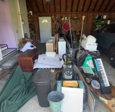 Cluttered garage before junk removal and cleanout