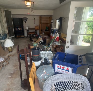 Garage filled with clutter before junk removal cleanout project