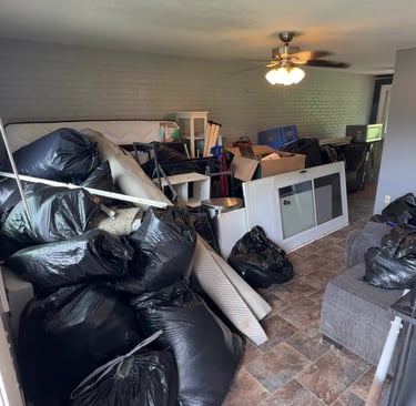 Apartment filled with furniture and clutter before junk removal cleanout