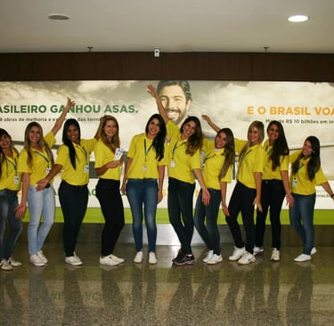 a group of people standing in front of a large poster