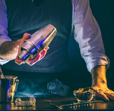 a bartender is making a drink at a bar