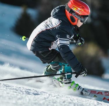 a person skiing down a snowy slope