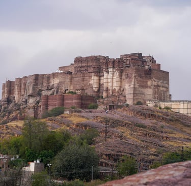 a castle like structure with a castle on top of a hill