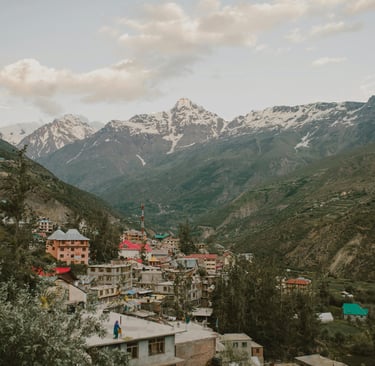 a mountain view of a town with a mountain in the background