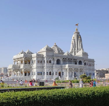 a large white building with a clock tower
