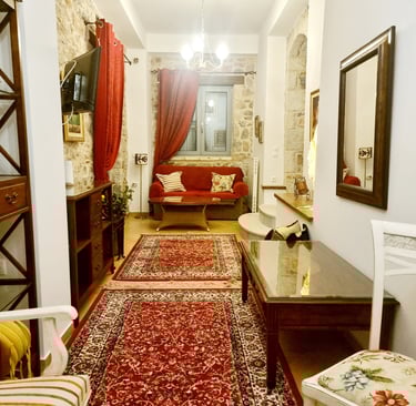 a living room with a red carpet and a red rug