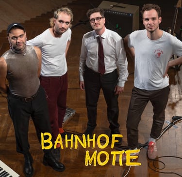 a group of men standing in front of a piano