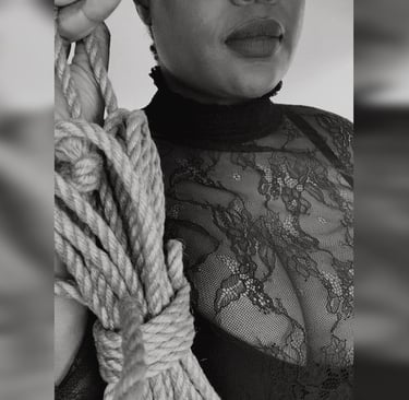 Dominatrix offering rope to viewer – beginner rope training and bondage in London