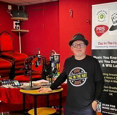 darrel hull (daz)  in a black shirt and a microphone