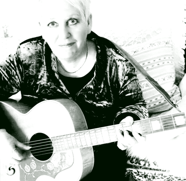 kath reade with a guitar and a guitar