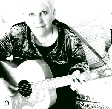 a black and white image of kath reade with a guitar 