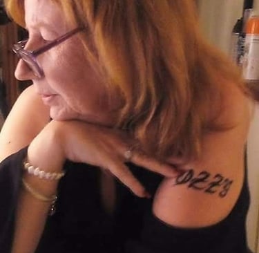 a woman with a tattoo on her arm