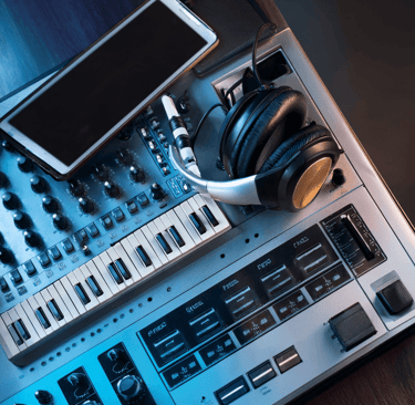 head set and mobile phone laid on a recoding studio