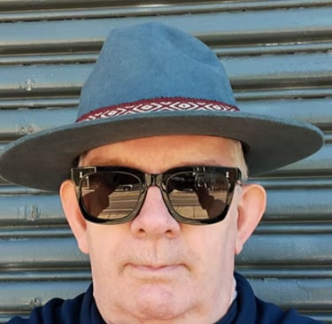 nick kemp wearing a hat and sunglasses