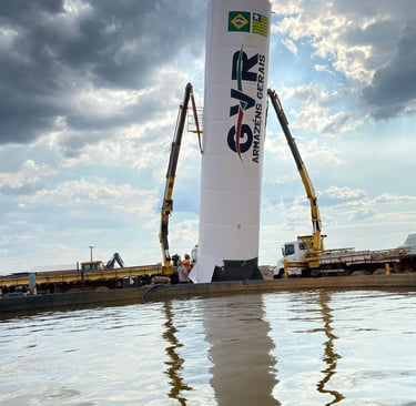 a crane is lifting a large white tower