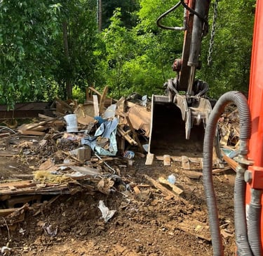 Property cleanout and demolition debris removal using heavy equipment by Valor Home Professionals