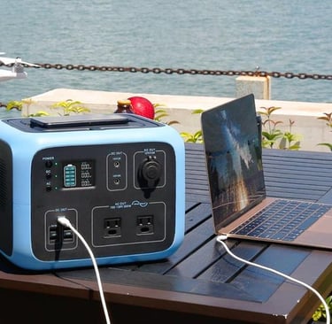 a laptop computer sitting on a table with a laptop and a laptop