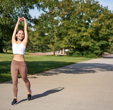 asian girl stretching after good workout in park