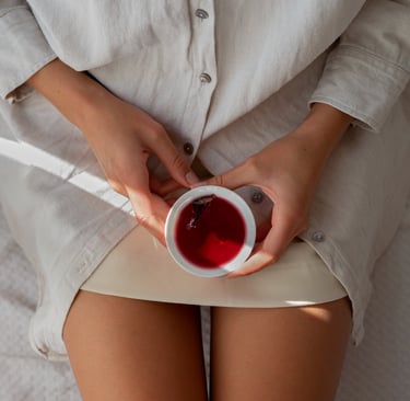 a woman in a white shirt and a cup of tea
