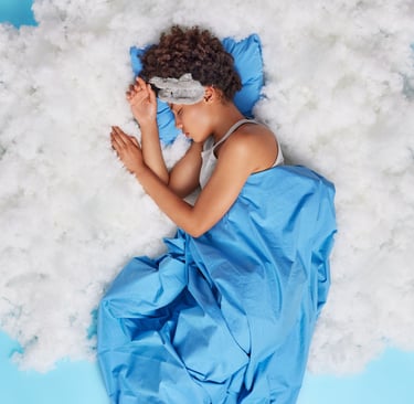 a woman sleeping in a cloud