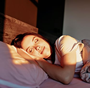 women with happy smile are sleeping in the bed in sunlight in modern apartment