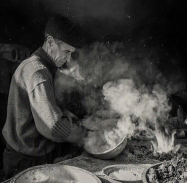 A Peruvian man cooking in a seafood restaurant