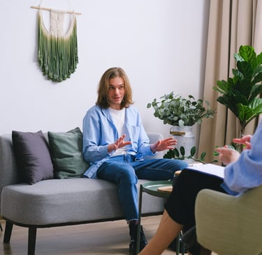 a woman sitting on a couch in a living room
