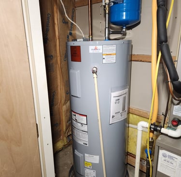 Newly installed electric water heater with safety valve in Rockville, MD residence