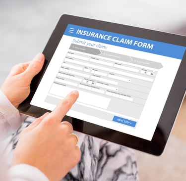 a person holding a tablet with a tablet screen displaying a claim form of insurance