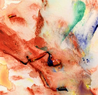 Abstract watercolor painting featuring vibrant red, blue, and green strokes on textured paper.