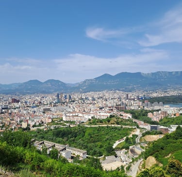 a view of a city from a hill top