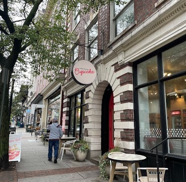 View of stores and Cupcake shop along sidewalks of downtown Lancaster, Pennsylvania
