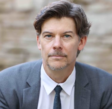 Headshot of Andrew Ludington, author.