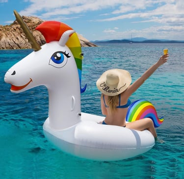 a woman in a swimsuit sitting on a floatie in the water