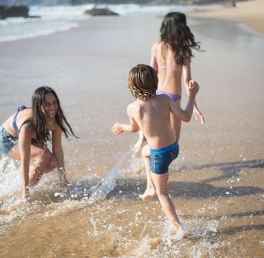 a group of children playing in the water