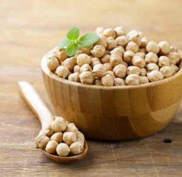 wooden bowl of raw chickpeas