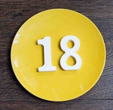 yellow plat with white numerals of 1 and 8