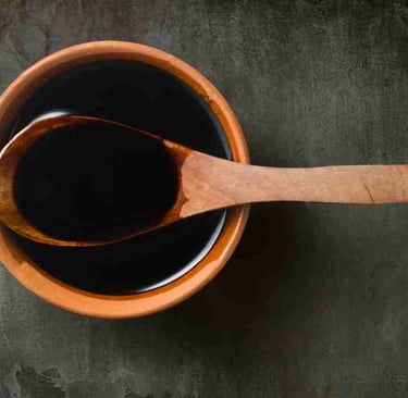 orietal style sauce ina wooden bowl